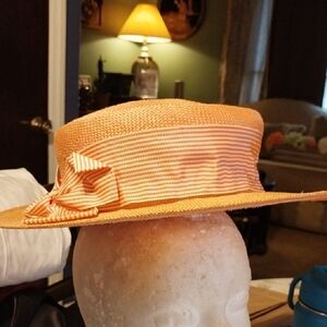 Elegant Orange Straw Boater Hat With Elastic Chin Strap.